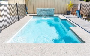 Concrete surrounds for swimming pool with pavilion finish